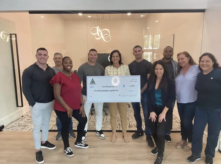 Geneva team presenting the 2023 grant check to Sweet Dream Makers